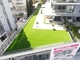 Πολύβλαστο πράσινο φυσικό να φανεί τεχνητός τάπητας τύρφης χλόης κήπων παχύς και μαλακός προμηθευτής